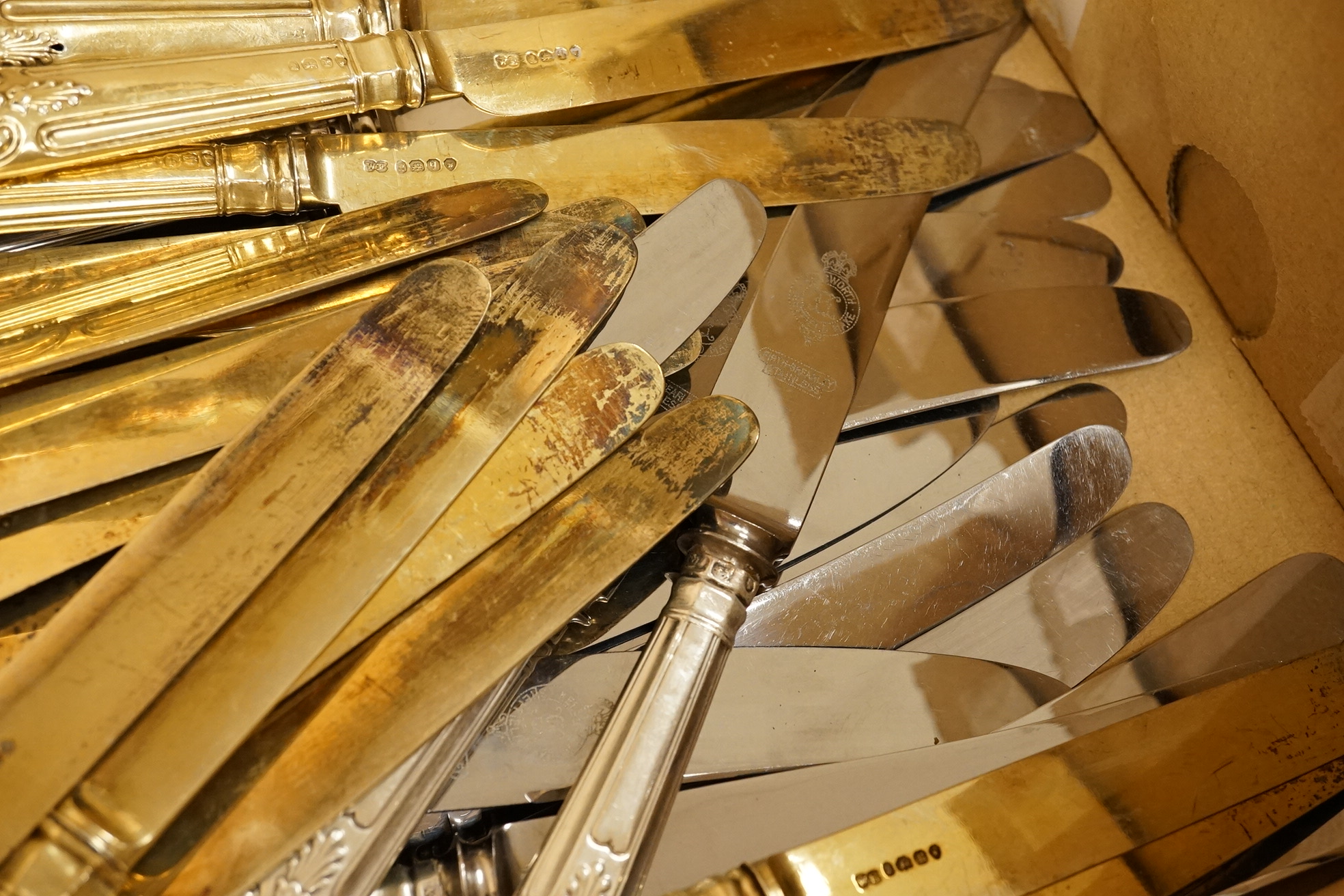 A set of eighteen William IV silver gilt King's pattern dessert knives, William Eaton, London, 1831/2, loaded handles, together with a set of twelve silver handled Kings pattern table knives and twelve matching dessert k